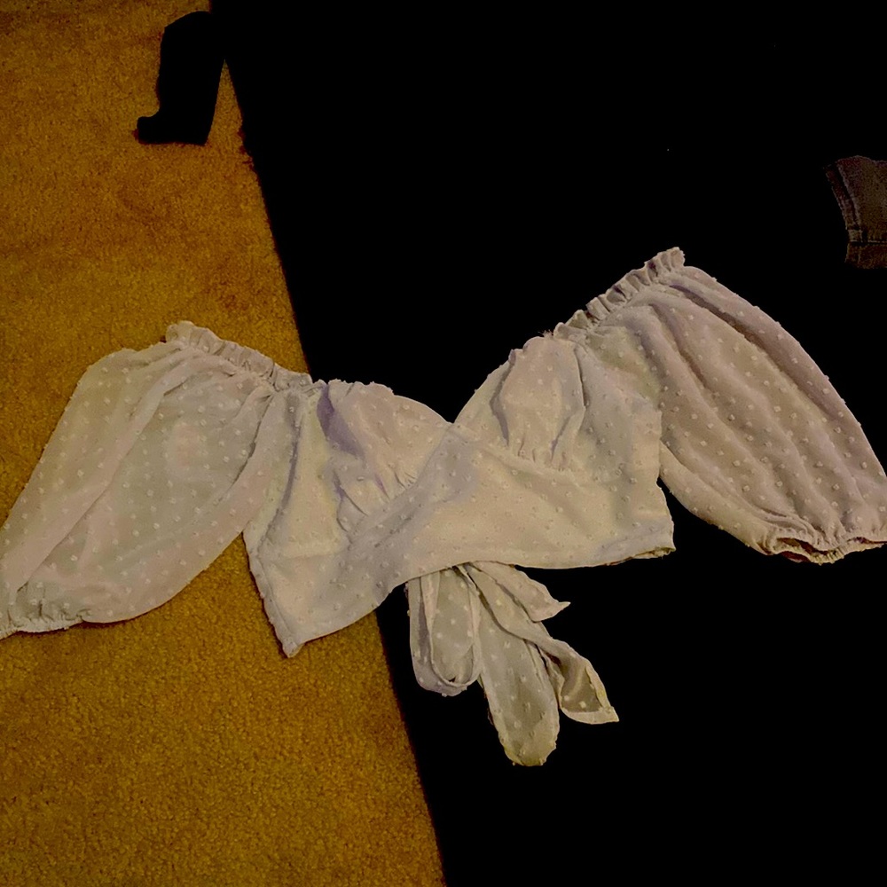 Cropped white shirt that ties in the back also can be worn off the shoulders